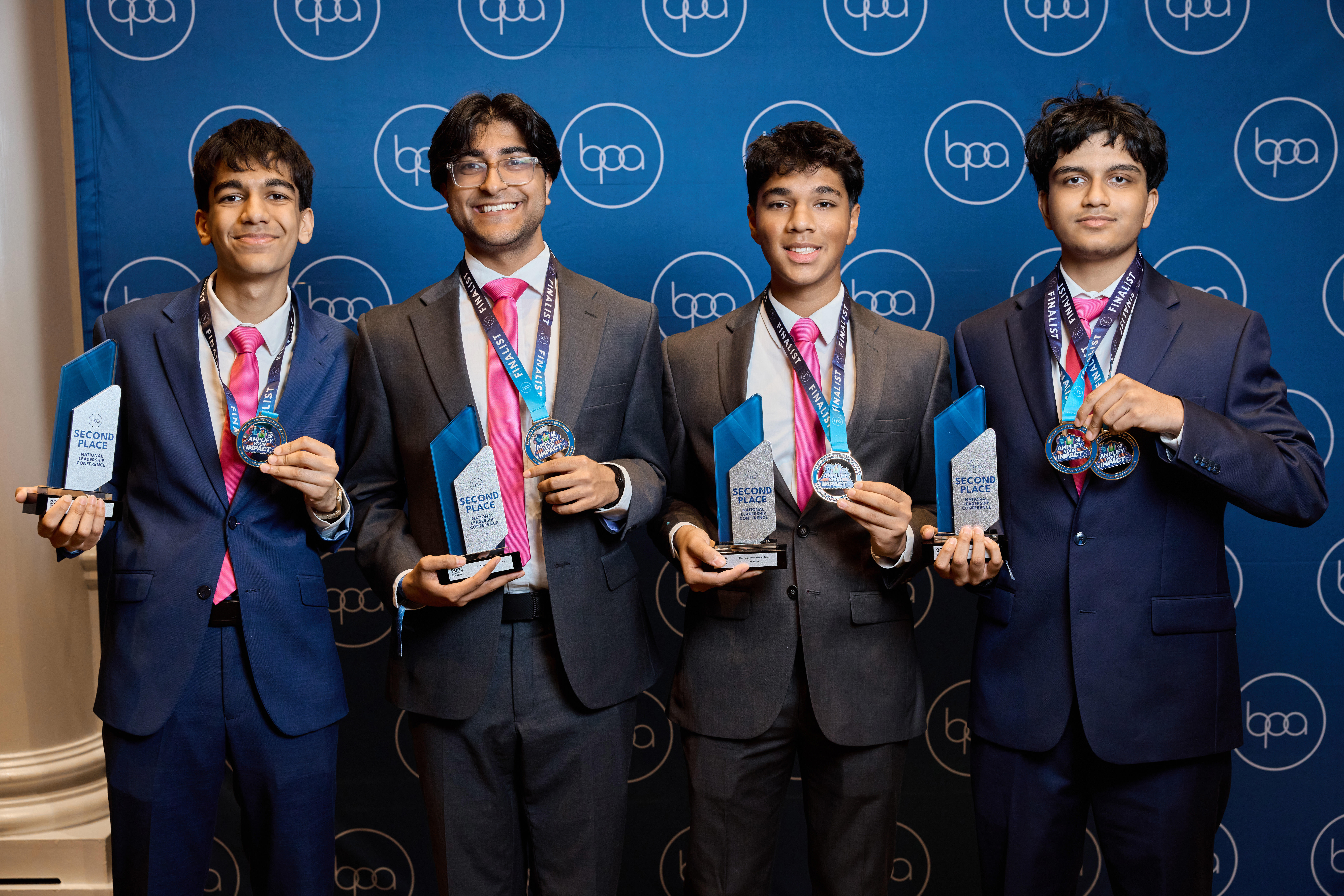 Akshaj Bansal and Aayush Patel holding their 2nd place BPA trophy